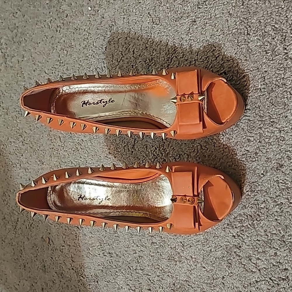 Orange spike platform heels